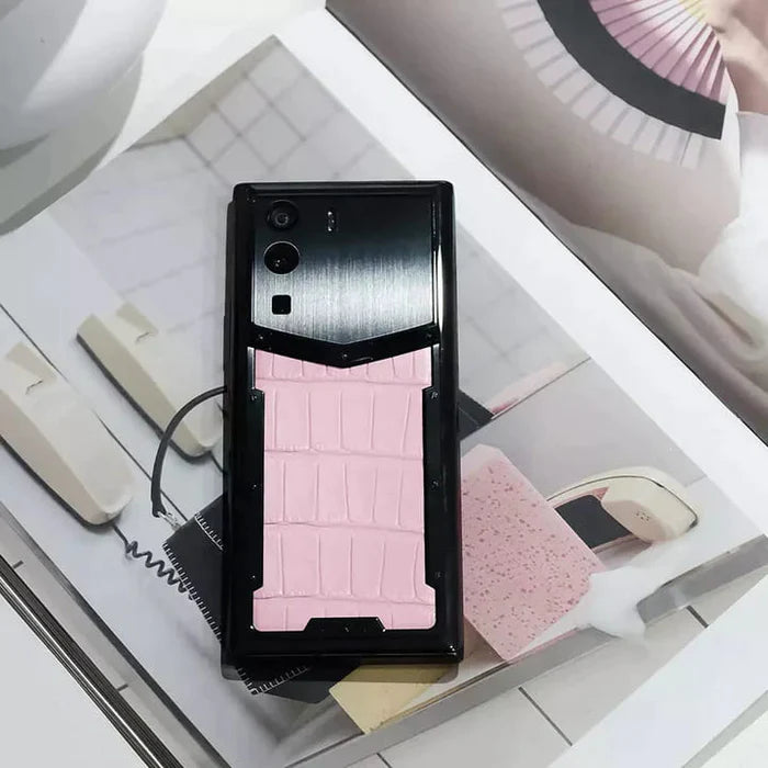 Vertu METAVERTU Sakura Pink Alligator Skin 5G Web3 Smartphone Side View Held by Model
